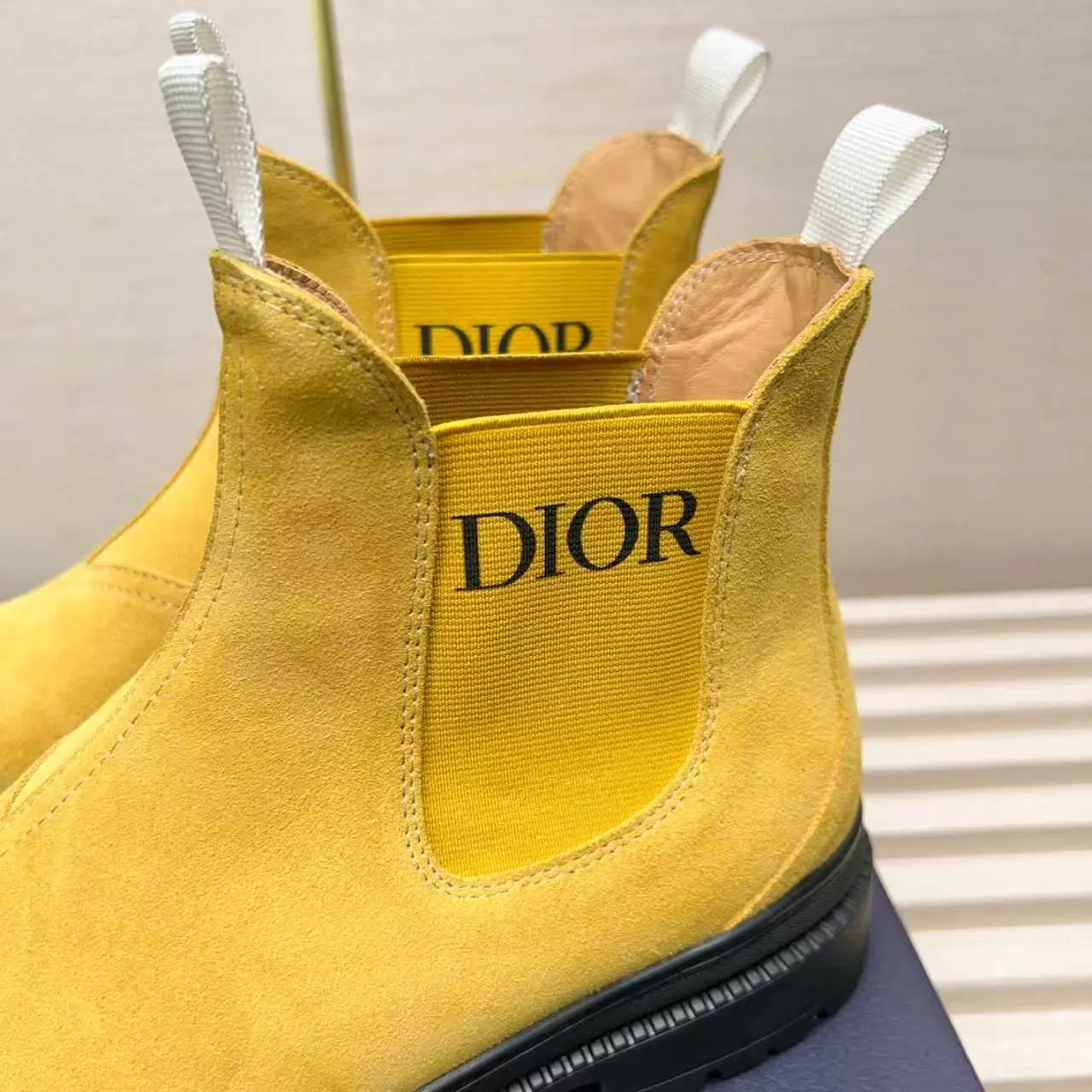 Men's Shoes 💰480 Dior A practical choice that combines protection with classic style. Made from durable Rugged Calf leather, it's tumbled and hand-finished to create a soft suede feel with a rich texture. Elastic side panels and subtle cutouts are inspired by the classic Chelsea boot. Leather upper and lining with Kummel tabs at front and rear, rubber outsole